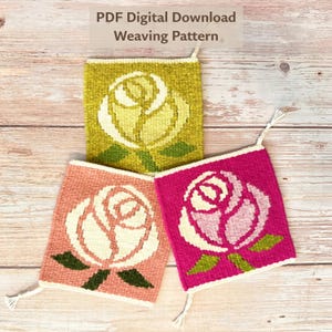 May include: Three square woven textile pieces featuring rose motifs. The top piece is olive green with a cream rose, the bottom left is dusty pink with a cream rose, and the bottom right is magenta with a light pink rose. Each has green leaves.