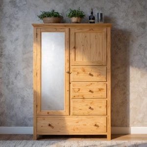May include: A light-colored wooden wardrobe with a full-length mirror on the left door and a solid wood door on the right. The wardrobe has four drawers and a top cabinet. Two small potted plants sit on top.