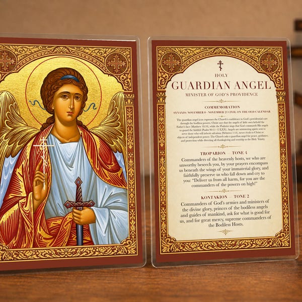 Könnte beinhalten: Eine doppelseitige religiöse Karte mit einer goldfarbenen Ikone eines Schutzengels, der ein Schwert hält, auf der einen Seite und dem Text "HOLY GUARDIAN ANGEL" mit Gebeten wie "TROPARION" und "KONTAKION" auf der Rückseite, in einem klaren Rahmen.