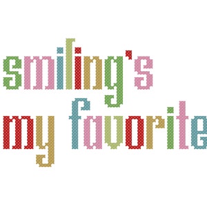 Op de afbeelding: Smiling's my favorite, een kleurrijk kruissteekontwerp met een speelse boodschap.