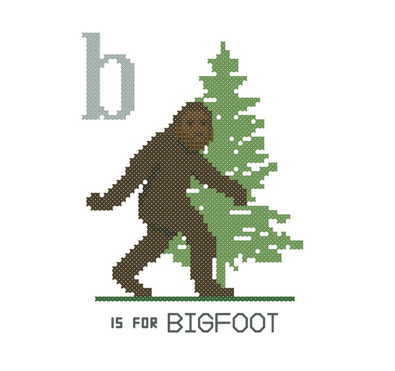 May include: A brown Bigfoot character standing next to a green pine tree. The letter "b" is above the Bigfoot. The text "is for BIGFOOT" is below the Bigfoot.