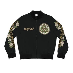 May include: A white ceramic mug with a black handle and the text "But First, Coffee" in a black, handwritten-style font. The mug is on a white surface.