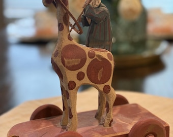 Signed Hand Carved Folk Art Giraffe & Rider Sculpture on Wheels, Dated 1993, Primitive Wooden Pull Toy Style Decor