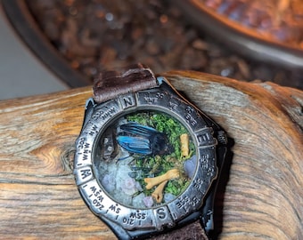 Tiny Terrarium! Carrion bettle, moss, bones, grape agate, smoky quartz, Vivianite, UV hyalite opal and Hackmanite in repurposed watch