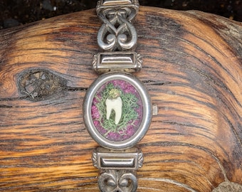 UV reactive vampire watch!! Muskrat tooth with lab Ruby in repurposed watch.