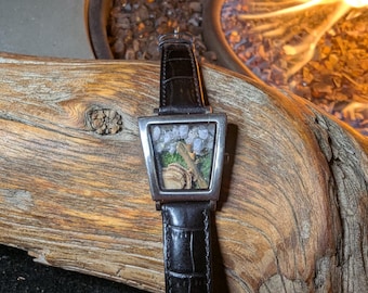 Tiny terrarium! Turkey tail mushroom, thorny rose stem, Hackmanite UV mineral and moss in repurposed watch.