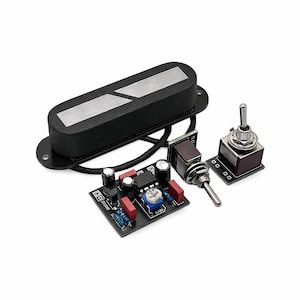 May include: Black guitar pickup with a silver accent, accompanied by a small circuit board with electronic components, and two toggle switches. The components are set against a white background.