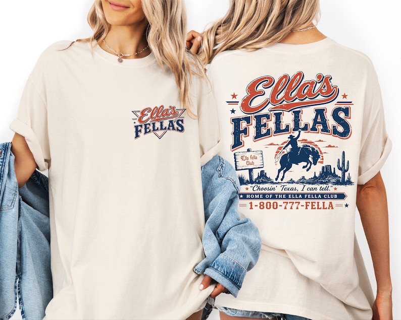 two women wearing white t-shirts with a graphic design on the back.