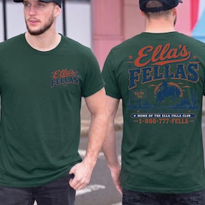 A man wearing a green t-shirt with text and graphics on the back.