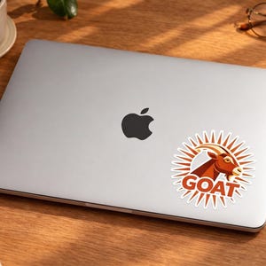 Claude Code GOAT Sticker | Abstract Terracotta Sunburst Kiss-Cut Vinyl