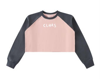 Sudadera corta raglán con bloques de color y dobladillo sin rematar