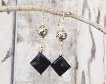 May include: Black onyx gemstone dangle earrings with silver filigree beads and silver hooks.