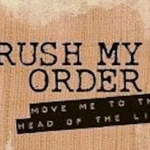 May include: A rectangular sign with the text "RUSH MY ORDER" in large, bold, black letters. Below, smaller text reads "MOVE ME TO THE HEAD OF THE LINE" on a black banner. The background has a textured, tan appearance.