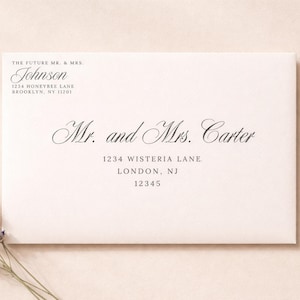 May include: A white envelope with elegant script, featuring the names "Mr. and Mrs. Carter" and address details. The top of the envelope reads "THE FUTURE MR. & MRS. Johnson" with an address. A sprig of lavender rests on the lower left.