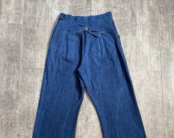 Vintage 1940s jeans . buckleback side button denim . 28-29 waist