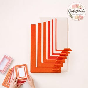 Pode incluir: Um conjunto de guias de enquadramento em forma de L de plástico laranja com medidas em polegadas gravadas, incluindo 1/8, 3/16, 1/4, 5/16, 3/8, 7/16, 1/2, 9/16, 5/8, 11/16, 3/4, 13/16, 7/8, 15/16 e 1 polegada, guardadas num estojo de plástico transparente.