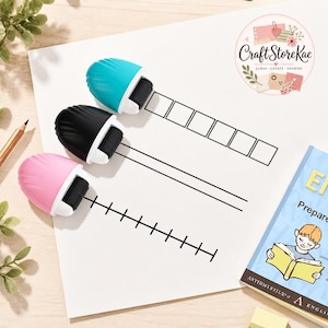 May include: Three handheld rolling stamps in teal, black, and pink, each featuring a white plastic casing and a black rubber roller. The stamps are positioned on white paper with printed lines and boxes, alongside a book and a pencil.