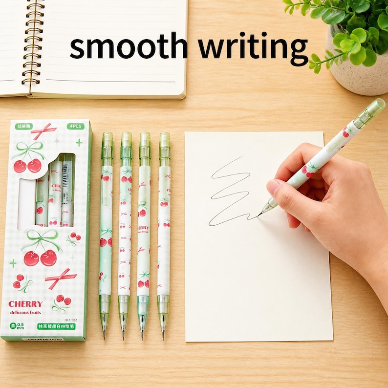 May include: A set of four mechanical pencils with a white and light green cherry pattern, packaged in a box labeled CHERRY delicious fruits 0.5 mm. The pencils feature a clear clip and tip, with one pencil shown writing on a white card.