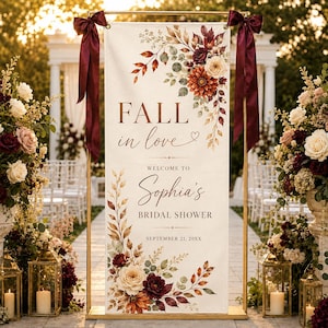 May include: A vertical rectangular banner featuring the text FALL in love, WELCOME TO Sophia's BRIDAL SHOWER, and SEPTEMBER 21, 20XX. The banner is decorated with watercolor-style autumn leaves and flowers in shades of burgundy, orange, and cream.