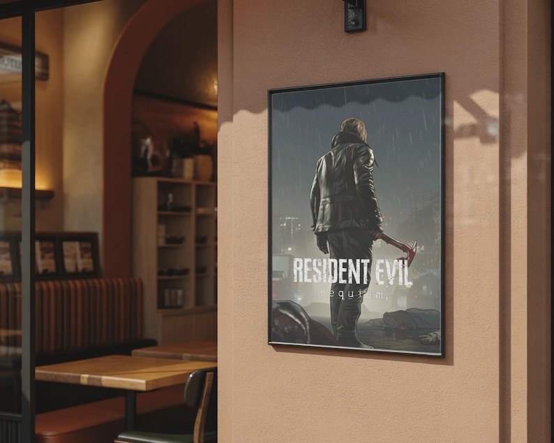 May include: A framed poster on a peach wall, depicting a figure in a leather jacket with a weapon, under a rainy sky. The poster's title is "RESIDENT EVIL: REQUIM". The background shows a cafe interior with tables and chairs.