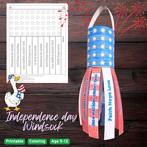 May include: A patriotic paper windsock craft featuring a blue cylinder with white stars and hanging red, white, and blue paper strips. The strips are printed with the text Freedom in Christ, God Bless America, One Nation Under God, Faith Hope Love, and In God We Trust.