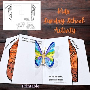 May include: A printable Kids Sunday School Activity featuring a colorful butterfly design. The open booklet displays the text "Jesus Makes All" and "Things New", with the quote "The old has gone, the new is here!" and the word "Printable".
