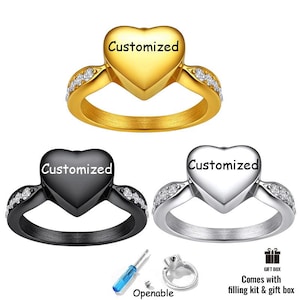 May include: Three rings in gold, black, and silver tones, each featuring a heart-shaped centerpiece with the word Customized printed on it. The bands are accented with small clear stones. Includes a small screwdriver and a filling kit.