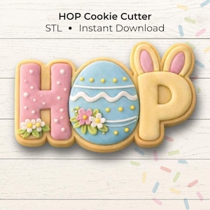 May include: A decorated cookie cutter in the shape of the word "HOP" with an Easter theme. The "H" is pink with white polka dots, the "O" is an Easter egg, and the "P" has bunny ears. The cookie cutter is on a white wooden background.