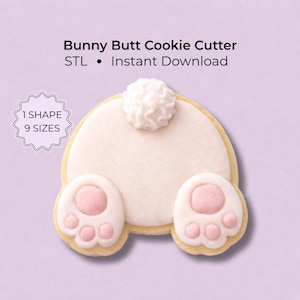 May include: A Bunny Butt Cookie Cutter STL file for instant download. The image shows a cookie shaped like a rabbit rear with a white tail and two feet with pink paw pads. Text on the image reads: Bunny Butt Cookie Cutter STL • Instant Download, 1 SHAPE 9 SIZES.