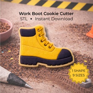 May include: A yellow and navy work boot cookie cutter. The cookie cutter is in the shape of a work boot with yellow and navy accents. The text "Work Boot Cookie Cutter" and "1 Shape 9 Sizes" are also visible.
