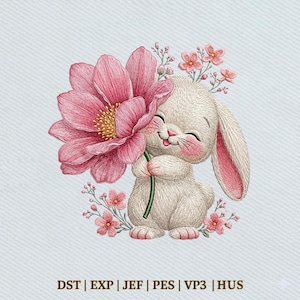May include: An embroidered design of a smiling white bunny holding a large pink flower. The bunny has pink inner ears and cheeks, with small pink flowers around its head. The image has the text "DST | EXP | JEF | PES | VP3 | HUS" at the bottom.