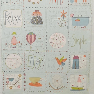 May include: A light blue fabric panel with whimsical illustrations and text. The panel features squares with drawings of a turtle, hot air balloon, bird, and a sailboat. Text includes "Relax", "Enjoy", and "Simple".