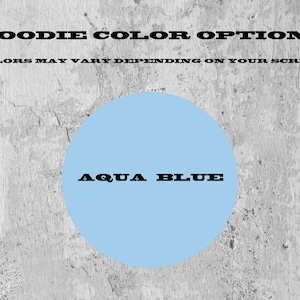 May include: A light blue circle representing an aqua blue hoodie color option. The text HOODIE COLOR OPTIONS and COLORS MAY VARY DEPENDING ON YOUR SCREEN appear at the top, with the text AQUA BLUE centered inside the light blue circle.