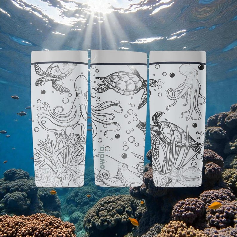May include: Three white water bottles featuring black line drawings of marine life, such as turtles and octopuses. The bottles have silver lids and the word "owala" is visible. The background depicts an underwater scene with coral and sunlight.