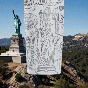 May include: A white Owala water bottle featuring a black and white line drawing of the Statue of Liberty, a football jersey with the number 17, and other American icons. The background shows the Statue of Liberty and the Hollywood sign.