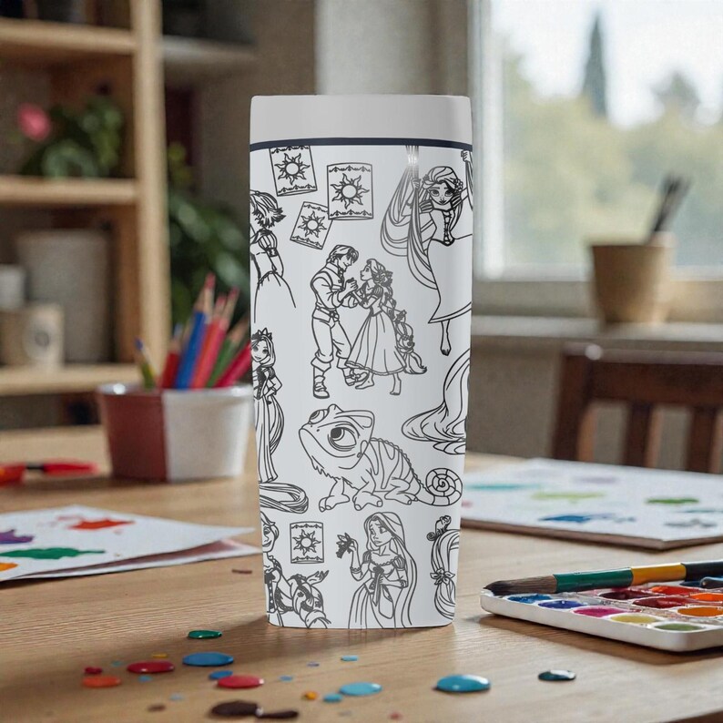 May include: A white tumbler featuring black line art illustrations of characters and elements from a popular animated movie. The design includes images of a princess, a chameleon, and other characters. The tumbler has a white lid and a black rim.