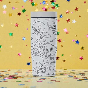 May include: A white tumbler featuring black line art of the cartoon character Tweety Bird in various poses. The design includes stars and other elements. The tumbler has a white lid and a cylindrical shape.