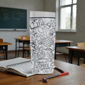 May include: A white and black water bottle with a school-themed design. The bottle features a white lid and is covered in black line drawings of school supplies, a globe, and the words "Back to School."