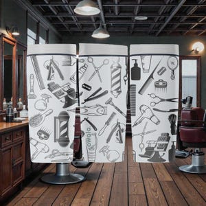 May include: A white barber shop privacy screen featuring a repeating pattern of barber tools, including scissors, razors, combs, and barber poles. The screen is divided into three panels and stands in a barber shop setting.