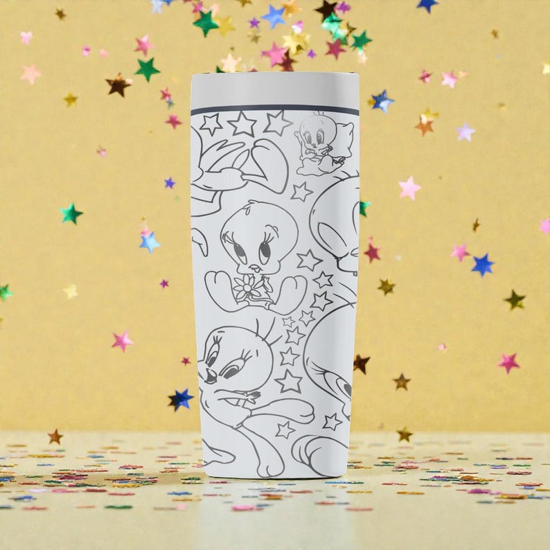May include: A white tumbler featuring a repeating black and white cartoon graphic of Tweety Bird and stars. The tumbler has a white lid and a cylindrical shape. The background is a gold color with scattered star-shaped confetti.