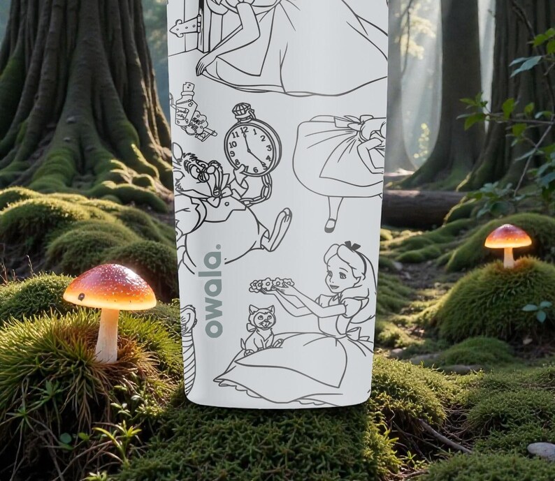 May include: A white Owala water bottle featuring black line art illustrations of characters and elements from Alice in Wonderland. The bottle is set against a forest backdrop with mushrooms.