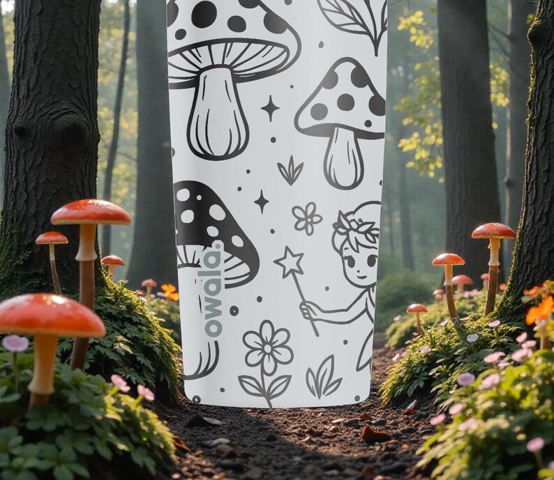 May include: White water bottle featuring a black and white design of mushrooms, flowers, and a fairy. The bottle has a repeating pattern of illustrations. The word "owala" is printed on the side of the bottle.
