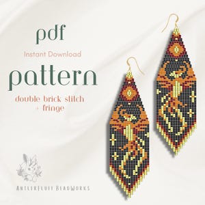 May include: A pair of beaded earrings with a geometric design in black, orange, red, and yellow. The earrings have a fringe and are suspended from gold-colored hooks. The image also includes the text "pdf Instant Download pattern double brick stitch + fringe".