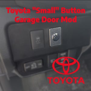 May include: A black button garage door mod for Toyota vehicles. The mod is installed on a black dashboard panel. The text "Toyota "Small" Button Garage Door Mod" is in red. The Toyota logo is visible.