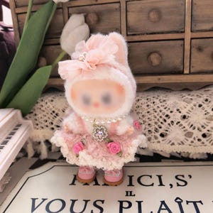 Pink crochet rose outfit set shown flat lay outfit only no figure included