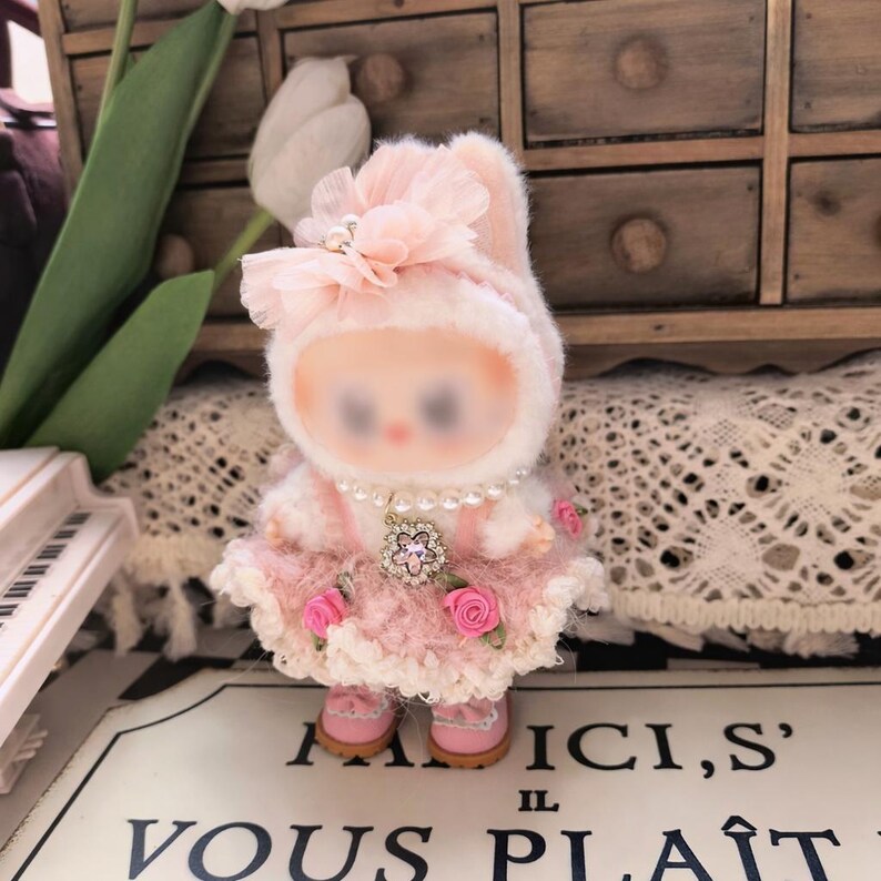 Pink crochet rose outfit set shown flat lay outfit only no figure included