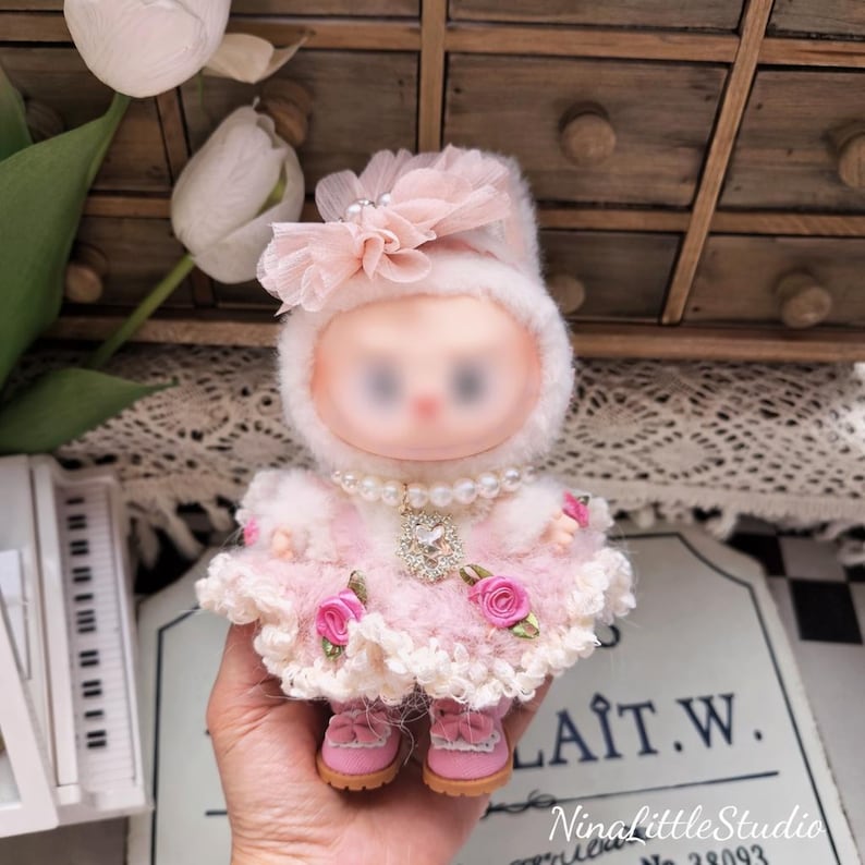 Pink crochet princess outfit displayed on 17cm figure