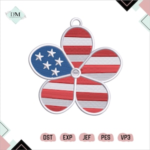 May include: Embroidered flower-shaped design featuring the American flag. The design includes red and white stripes, a blue section with white stars, and a small loop at the top for hanging. The design is on a white background.