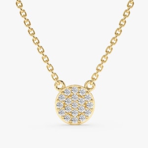 Dainty round diamond cluster necklace in yellow gold with delicate chain.