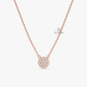 Minimal gold diamond disc pendant necklace for everyday wear.